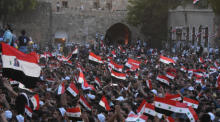 Die Anhänger des syrischen Präsidenten Bashar Assad feiern seine Wiederwahl. Foto: epa/Youssef Badawi