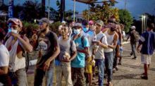 Migranten aus Honduras. Foto: epa/Esteban Biba