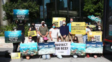 Umweltaktivisten protestieren gegen die Bedrohung des Great Barrier Reefs. Foto: epa/Jono Searle