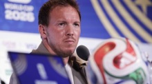Julian Nagelsmann beantwortet auf einer Pressekonferenz vor dem WM-Sechzehntelfinale gegen Paraguay Fragen der Medien. Foto: EPA/Shawn Thew