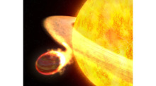 Die Illustration, die zum Teil auf der Analyse der spektroskopischen und photometrischen Daten von Hubble basiert, zeigt den Exoplaneten WASP-12b. Foto: G. Bacon/Nasa, Esa (stsci)/dpa