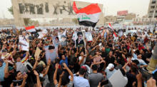 Die Anhänger der sadistischen Bewegung tragen die Bilder von Muqtada al-Sadr. Foto: epa/Ahmed Jalil