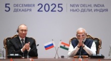 Ein Fernsehbildschirm zeigt den indischen Premierminister Narendra Modi während einer im Fernsehen übertragenen Rede. Foto: epa/Piyal Adhikary