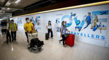 Passagiere auf dem internationalen Flughafen Suvarnabhumi in Bangkok. Foto: epa/Diego Azubel
