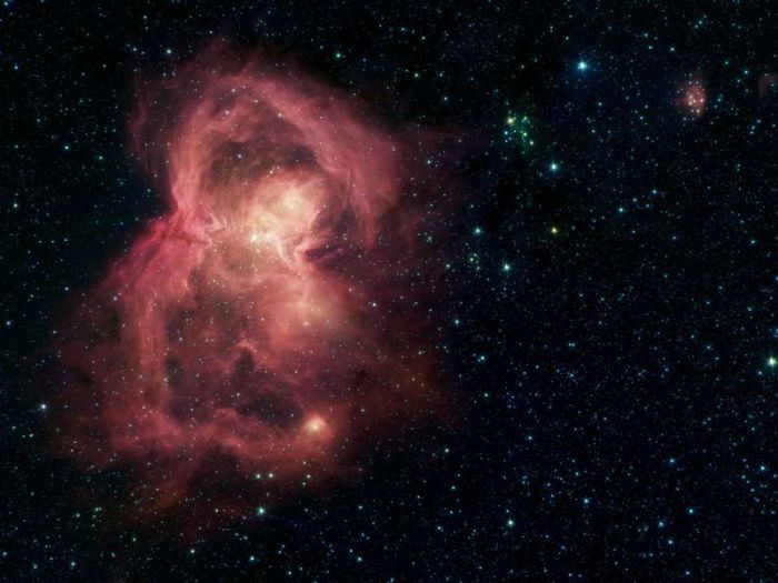 Eine Infrarotfotografie des «Spitzer»-Weltraumteleskops zeigt einen rotgefärbten Gasnebel in Schmetterlingsform. Foto: NASA/Jpl-caltech/dpa