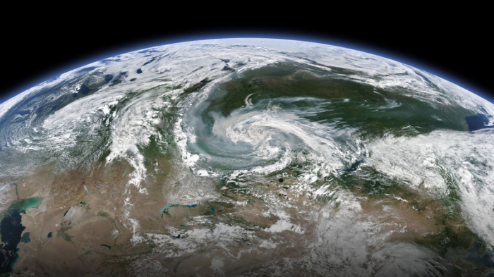Rauchschwaden, die sich mit einem größeren Sturmsystem vermischen, ziehen über Sibirien. Foto: NASA/Zuma Wire/dpa