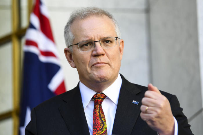 Der Australische Premierminister Scott Morrison spricht während einer Pressekonferenz im Parlamentsgebäude in Canberra zu den Medien. Foto: epa/Lukas Coch