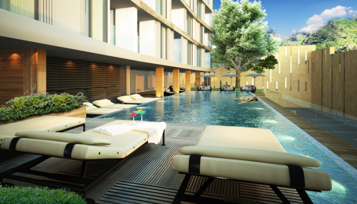 Dinso Residence wird umgeben von einer grünen Gartenanlage im schicken Resortstil, in Niedrigbauweise errichtet.