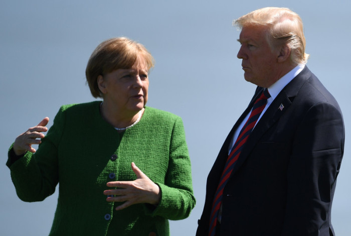US-Präsident Donald Trump (r.) und Deutschlands Bundeskanzlerin Angela Merkel (l.). Foto: epa/Neil Hall