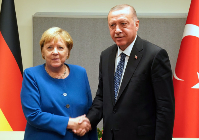 Bundeskanzlerin Angela Merkel (CDU) trifft am Rande des UN-Klimagipfels bei den Vereinten Nationen Recep Tayyip Erdogan, Präsident der Republik Türkei. Foto: Kay Nietfeld/Dpa