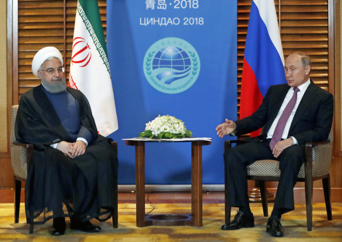 Der russische Präsident Wladimir Putin (r.) und der iranische Präsident Hassan Rouhani (l.). Foto: epa/Sergei Chirikov