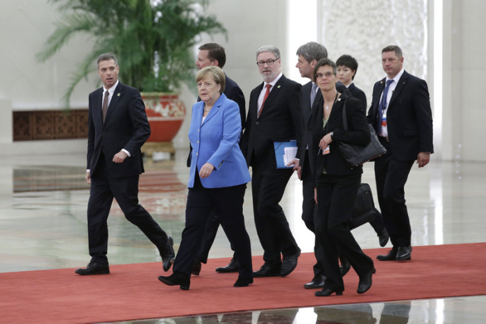Bundeskanzlerin Angela Merkel (2. v. l.). Foto: epa/Jason Lee