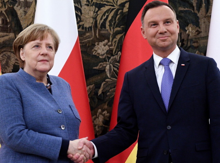 Deutschlands Bundeskanzlerin Angela Merkel (l.) und der polnische Präsident Andrzej Duda  (r.). Foto: epa/Jacek Turczyk