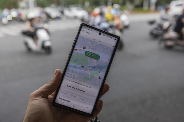 Die mobile Anwendung des Ride-Hailing-Riesen Didi Chuxing ist auf einem Smartphone in Shanghai zu sehen. Foto: epa/Alex Plavevski
