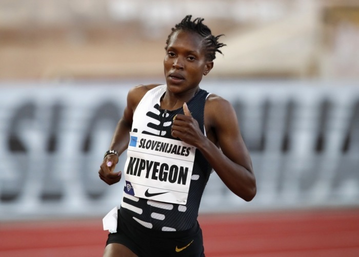 Kenianerin Faith Kipyegon in Aktion beim 1-Meilen-Lauf der Frauen beim Diamond League Herculis Leichtathletik-Meeting in Monaco. Foto: epa/Sebastien Nogier