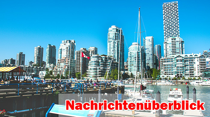 Blick auf den Yachthafen und die markante Glas-Skyline von Vancouver an einem klaren Sommertag mit kanadischer Flagge im Vordergrund. Foto: Unsplash/Udayaditya Barua