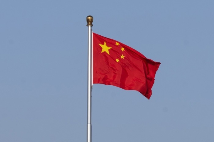Chinesische Flagge weht am Tiananmen-Platz vor den jährlichen politischen Sitzungen von NPC und CPPCC in Peking. Foto: epa/Jessica Lee