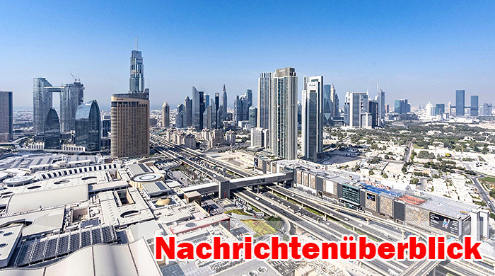 Blick über die Sheikh Zayed Road in Dubai mit ihren markanten Hochhäusern, Wolkenkratzern im Finanzviertel und den flachen Vorstädten im Hintergrund. Foto: Unsplash/Nelemson Guevarra