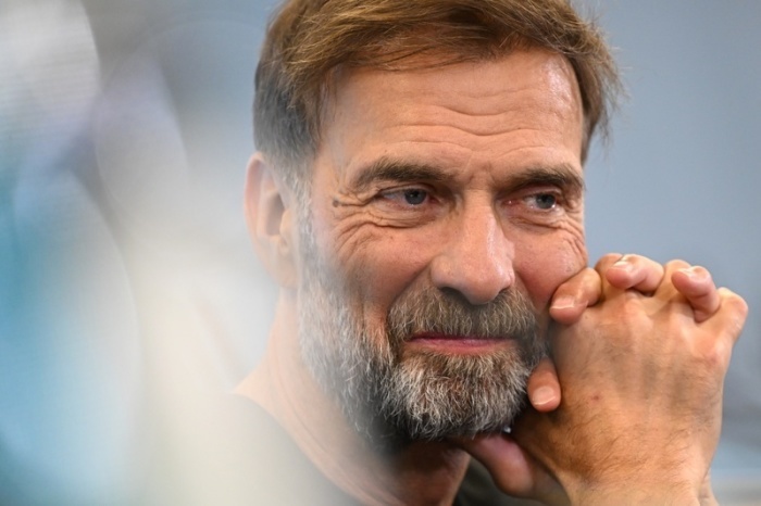 Fußball, DFB, Nationalmannschaft, Pk zur Vorstellung des neuen Bundestrainers, Jürgen Klopp lächelt bei einer Pressekonferenz. Foto: Florian Wiegand/dpa